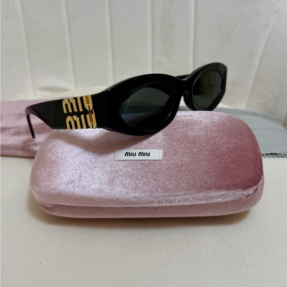 Miu Miu Accessories - Miu Miu Black Oval Sunglasses with Gold Logo Temples